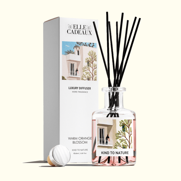 Elle Cadeaux Warm Orange Blossom 6oz luxury reed diffuser bottle with black reeds and gift box on cream background