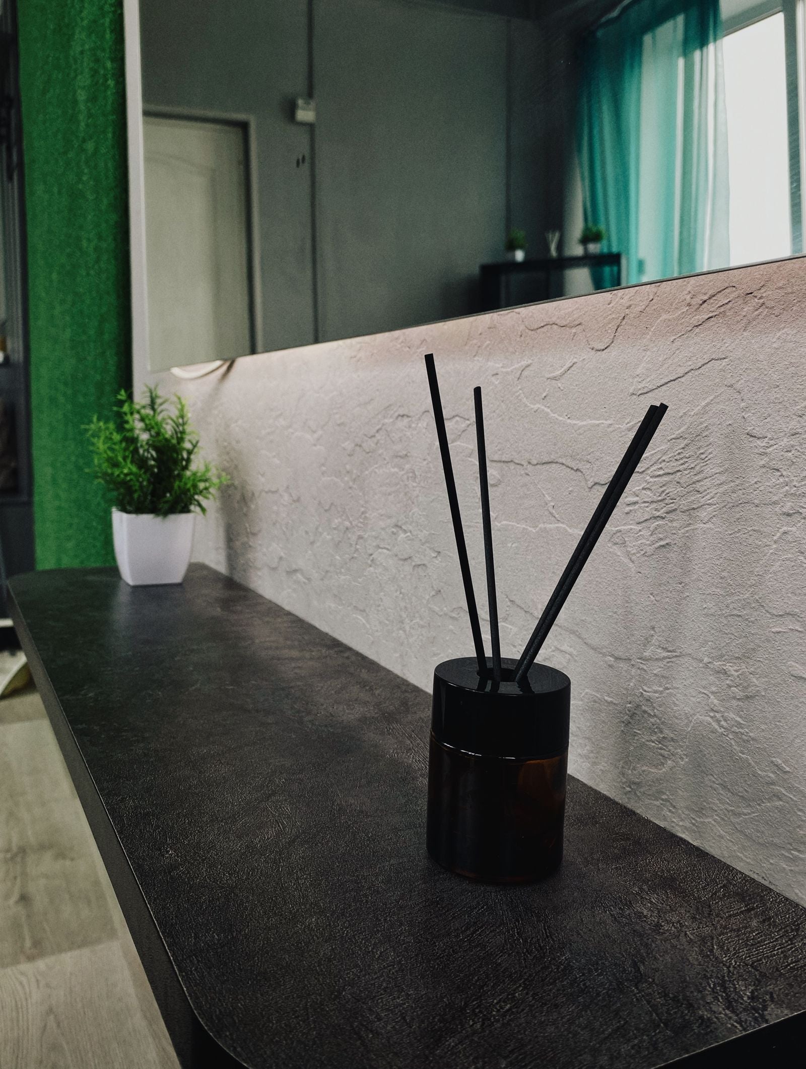 How to Create a Signature Home Scent — reed diffuser in a modern home interior